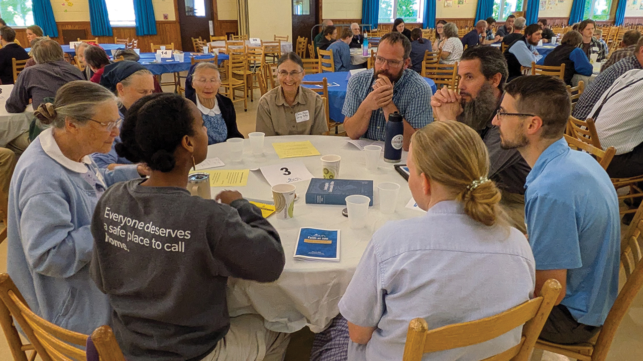 Faith at 500 attendees discuss reflection questions in small groups. — Toby Mommsen