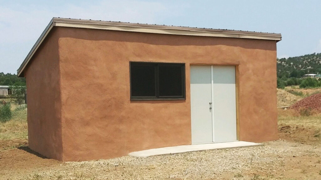 This barn/utility building with about 3,000 pounds of post-consumer plastic in its walls was approved by Taos County Planning and Zoning. — Todd Wynward