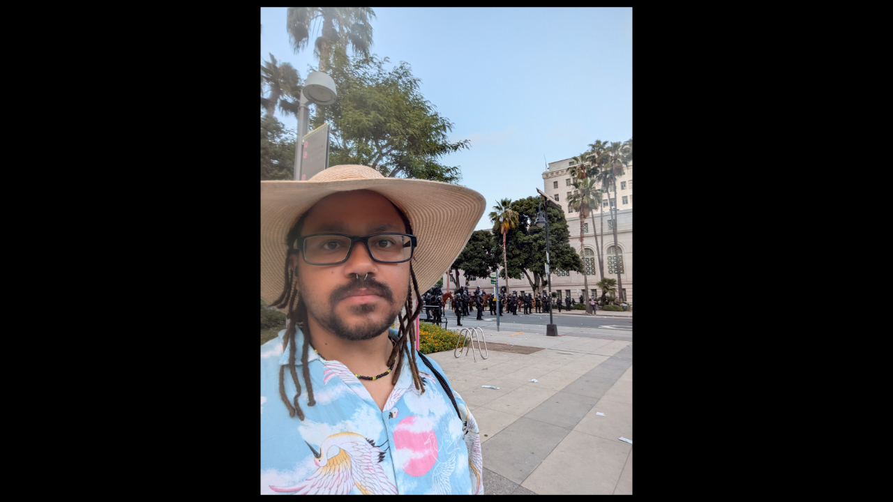 AJ Delgadillo at an ICE protest moments before the Los Angeles Police Department shot rubber bullets at civilians, including a reporter. — AJ Delgadillo