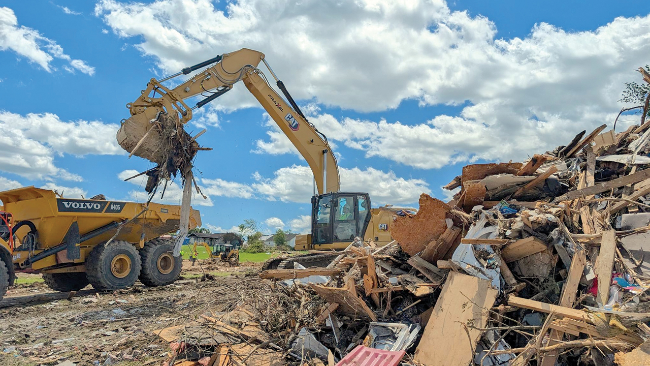 Mennonite Disaster Service volunteers from Ohio clean up debris from a tornado in May after it damaged many properties in London and Somerset, Ky. — Mennonite Disaster Service