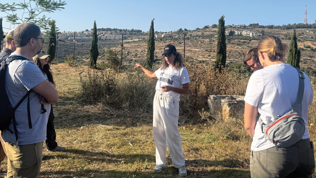 Alice Kisiyeh, center, describes how Israeli settlers work to take her family’s land in the Al Makhrour valley. Her family worked in the courts to reclaim their property, receiving the news just before the Mennonite Action delegation’s visit. —Mennonite Action