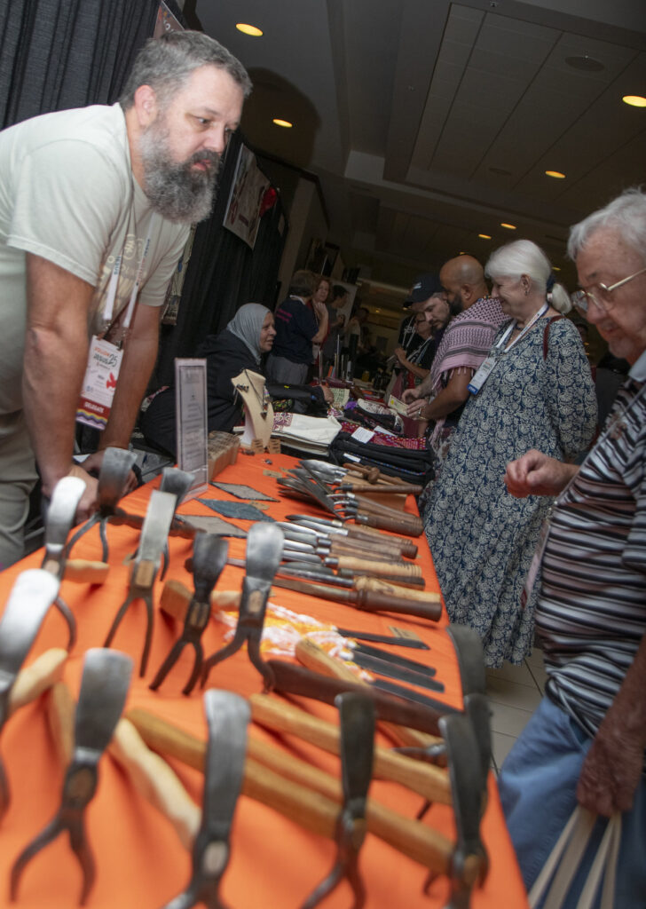 Mike Martin, who led a seminar on “What to Do About Gun Violence,” displays tools made from guns. — Juan Moya/AW