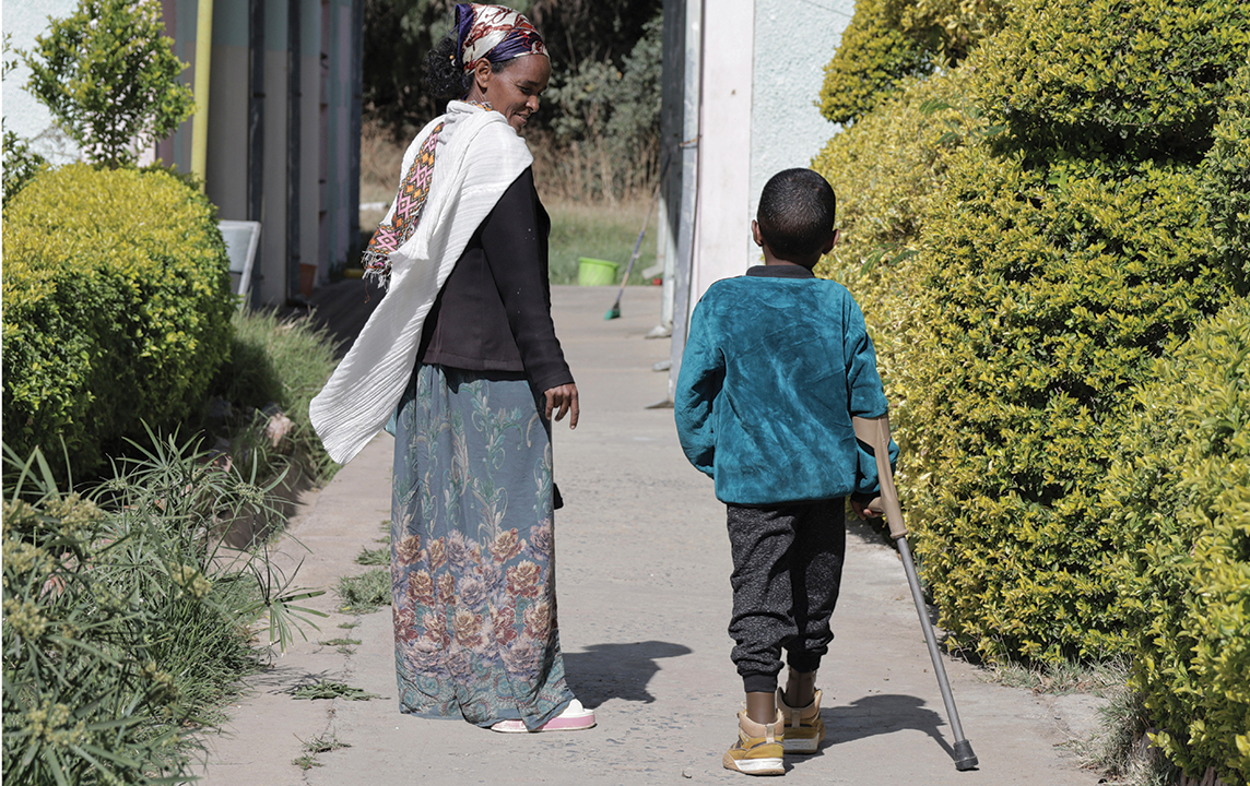 A boy who lost his leg during the recent war walks with his mother during a visit at Ortho-Physiotherapy Centre in Mekele, Tigray region of northern Ethiopia, on Feb. 14. — Amanuel Birhane/AP