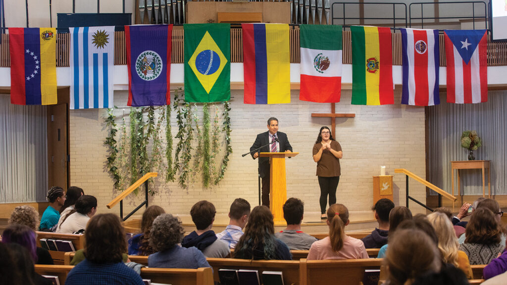 Cristobal Garza Gonzalez, professor of Spanish, speaks at a Hispanic Heritage Month convocation at Goshen College in September 2023. — Goshen College