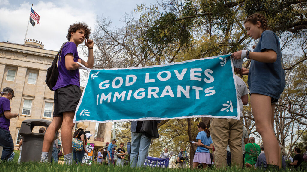 People demonstrate in spring 2025 in Raleigh, N.C., during Mennonite Action’s “God’s Love Knows No Borders” worship services. — Mennonite Action