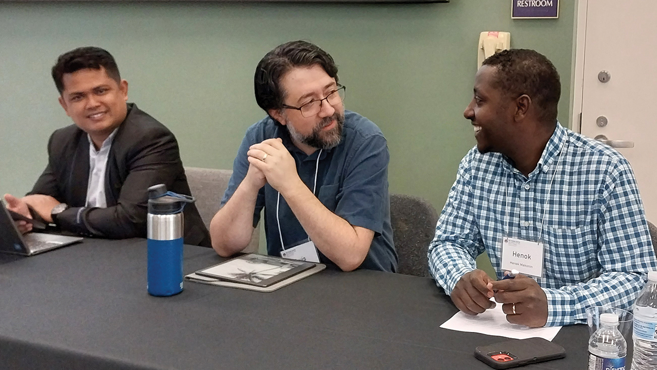 Teguh Karyanto, left, Luis Tapia and Henok Mekonin present papers during a panel on “Anabaptism and Identity in the Contemporary World.” — Eileen Kinch/AW