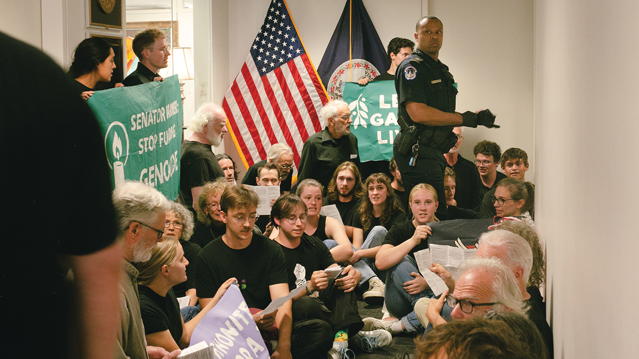 Law enforcement officers respond to Mennonite Action participants singing outside the congressional office of Sen. Mark Warner in Washington, D.C. — Mennonite Action