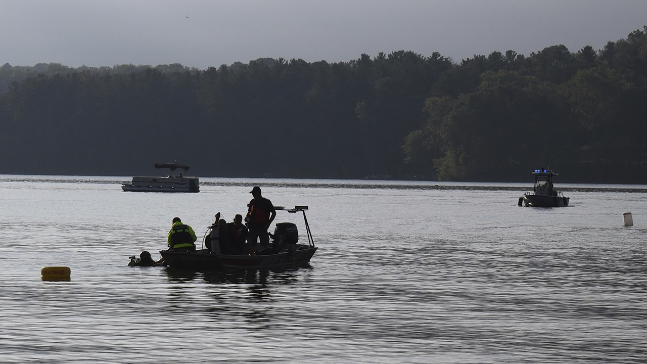 Members of a dive team on Atwood Lake, Ohio, float over the spot where they recovered the body of Marcus Miller on Aug. 24, a day after Miller’s wife allegedly killed their 4-year-old son by throwing him into the lake. — Tuscarawas County Sheriff's Office via Associated Press