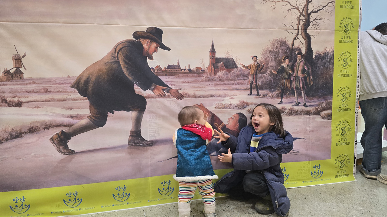 Siblings Soli Spicher-Lee, left, and Menno Spicher-Lee act out the story of Dirk Willems at an Anabaptism at 500 celebration in February in Chuncheon, South Korea. Their parents, Jae Young Lee and Karen Spicher, live and work at Peace Building Community, which is home to three organizations: Northeast Asia Regional Peacebuilding Institute, Korea Peacebuilding Institute and Korea Association for Restorative Justice. Karen Spicher is communications coordinator for NARPI. Jae Young Lee is executive director of NARPI, chair of KARJ and executive director of KOPI. — Bockki Kim
