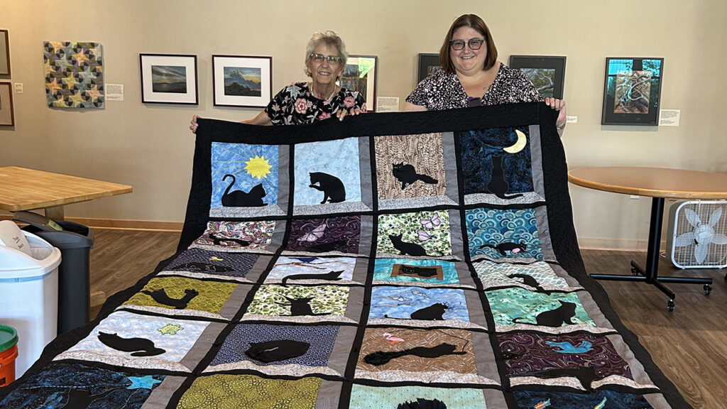 Evelyn Turner and daughter Rebekah Turner (the 2-year-old in the article) with a quilt they finished this year in honor of Rebekah’s 19-year-old cat. — Courtesy of Evelyn Turner