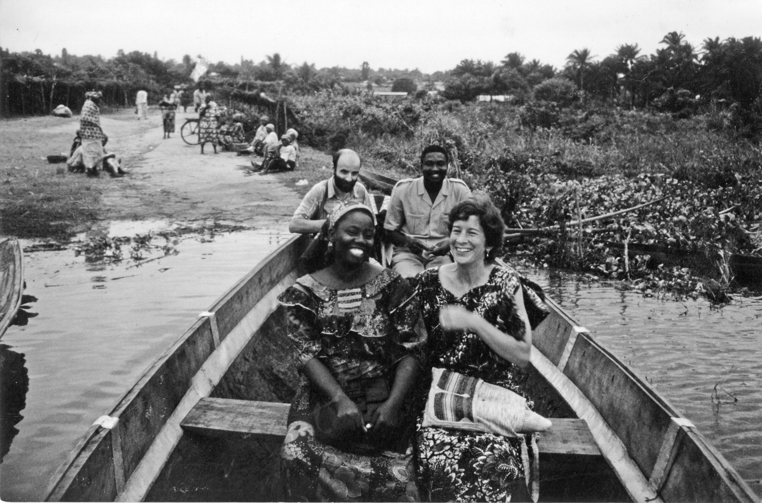 From back left, Daniel Goldschmidt-Nussbaumer, a Mennonite Board of Missions doctor from France, and Saturnin Afaton, a Beninese lawyer. From front left, Rebecca Assani, an Apostolic Church educator, and Lynda Hollinger-Janzen begin a river crossing in a pirogue (dugout canoe) during a community health trip to Gbeko in 1987.