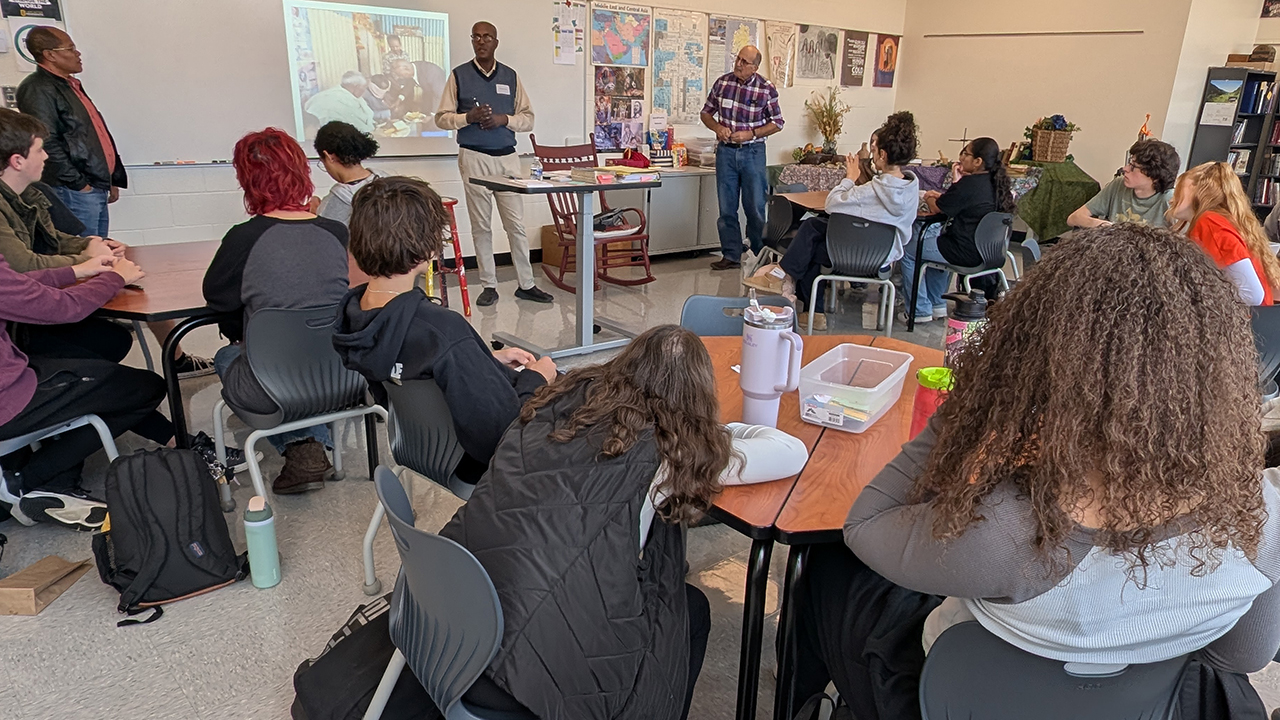 Gishu Jebecha, principal of Meserete Kristos Seminary; Desalegn Abebe, president of Meserete Kristos Church; and Mark Wenger, LMC bishop; speak in Lancaster Mennonite Bible teacher Dean Sauder’s Global Christianity High School Bible class. — Aubrey Kreider/Lancaster Mennonite School