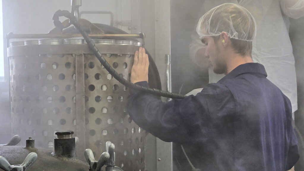 Canner operator Kenan Broersma at work in the mobile cannery in 2024. — George Eckman/MCC