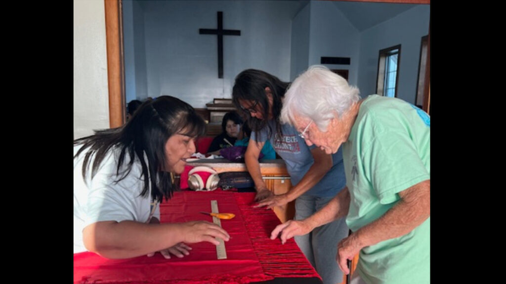 Ruth Bearshield, Ruth Samarrah Gallegos and Betty Hart work on shawls for the girls. — Susan Hart