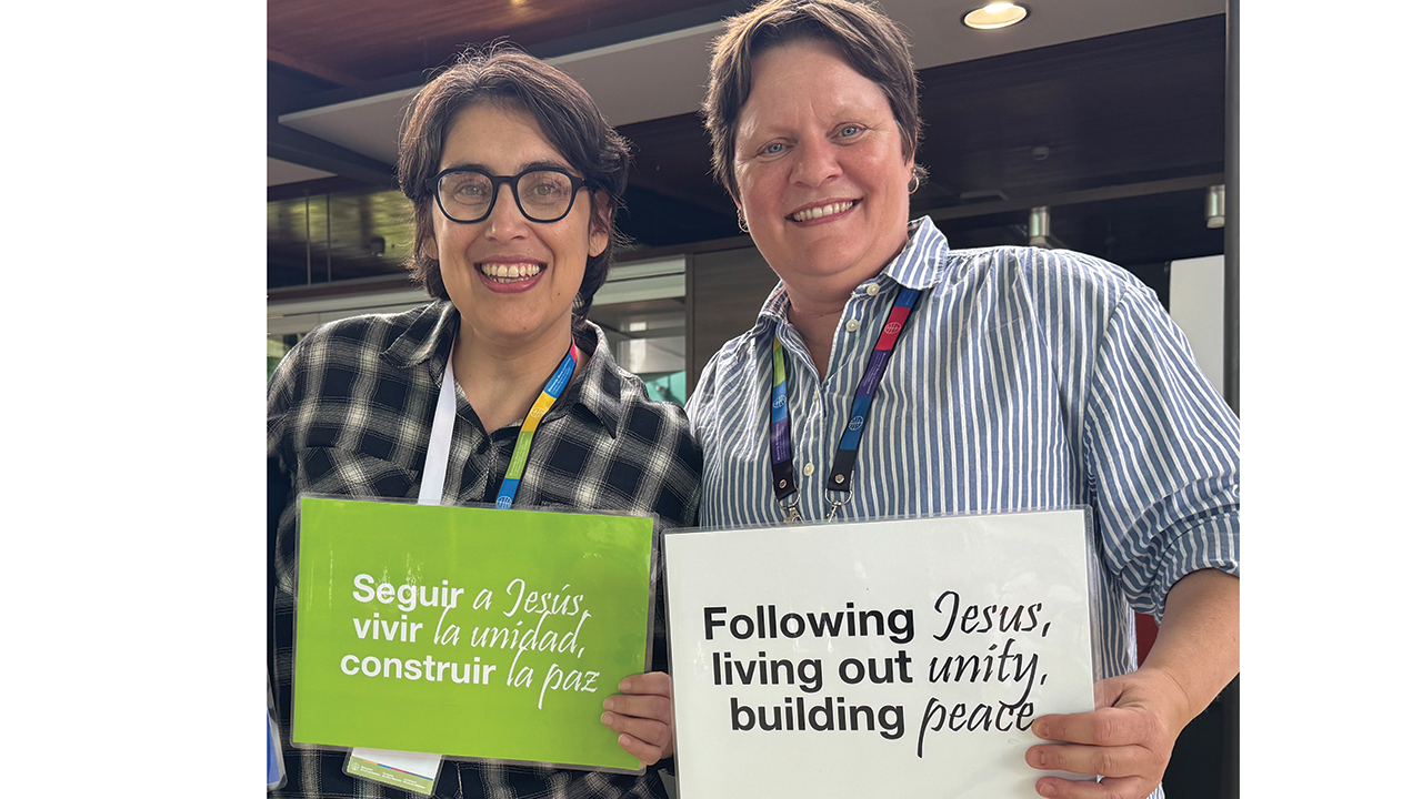 At the Mennonite World Conference General Council meeting in May, Karina Derksen-Schrock, right, of the United States coordinated a translation team that included Rut Correa, left, of Paraguay. — Elina Ciptadi/MWC