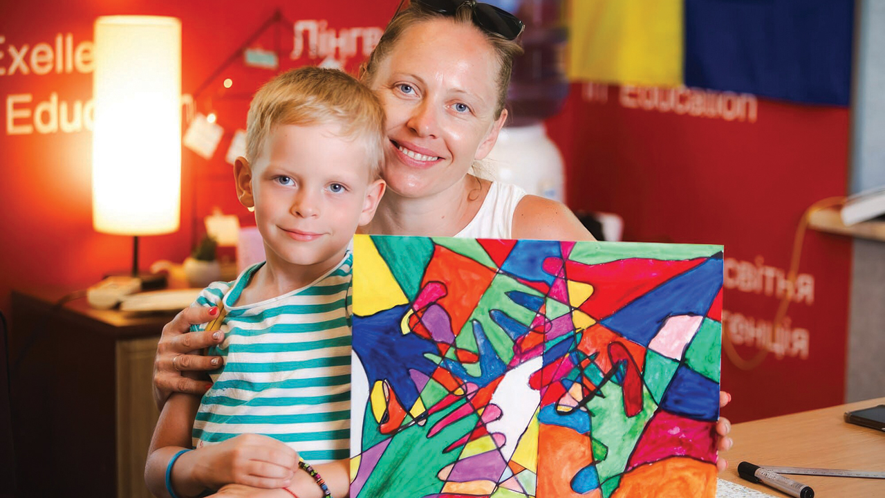 A mother and son display art they made during a therapy session at New Hope. — Courtesy of New Hope
