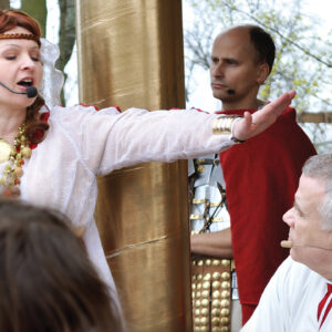 Pilate’s wife urges Pilate to acquit Jesus during a street performance of “Mystery of the Passion” on April 17, 2011, in Gora Kalwaria, Poland. — Stanislaw Tokarski/Shutterstock