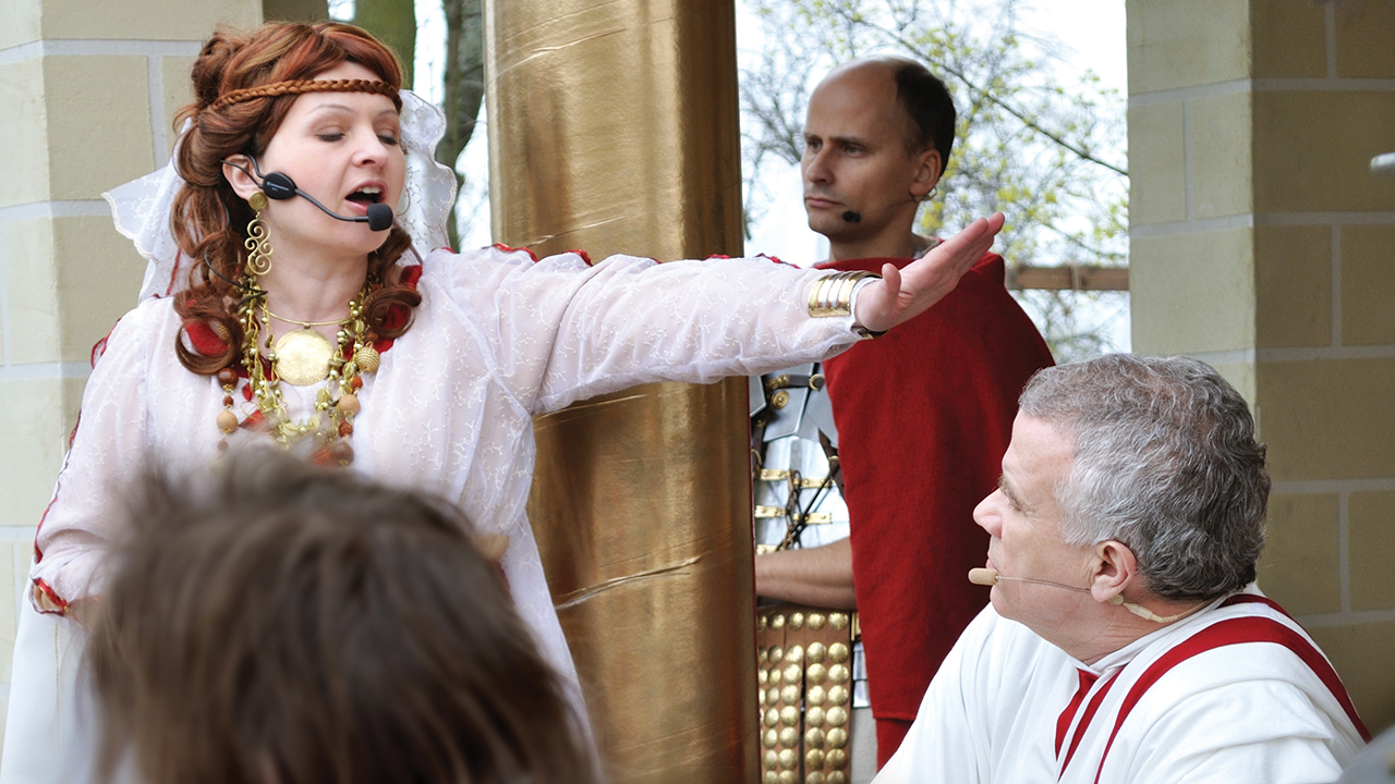 Pilate’s wife urges Pilate to acquit Jesus during a street performance of “Mystery of the Passion” on April 17, 2011, in Gora Kalwaria, Poland. — Stanislaw Tokarski/Shutterstock
