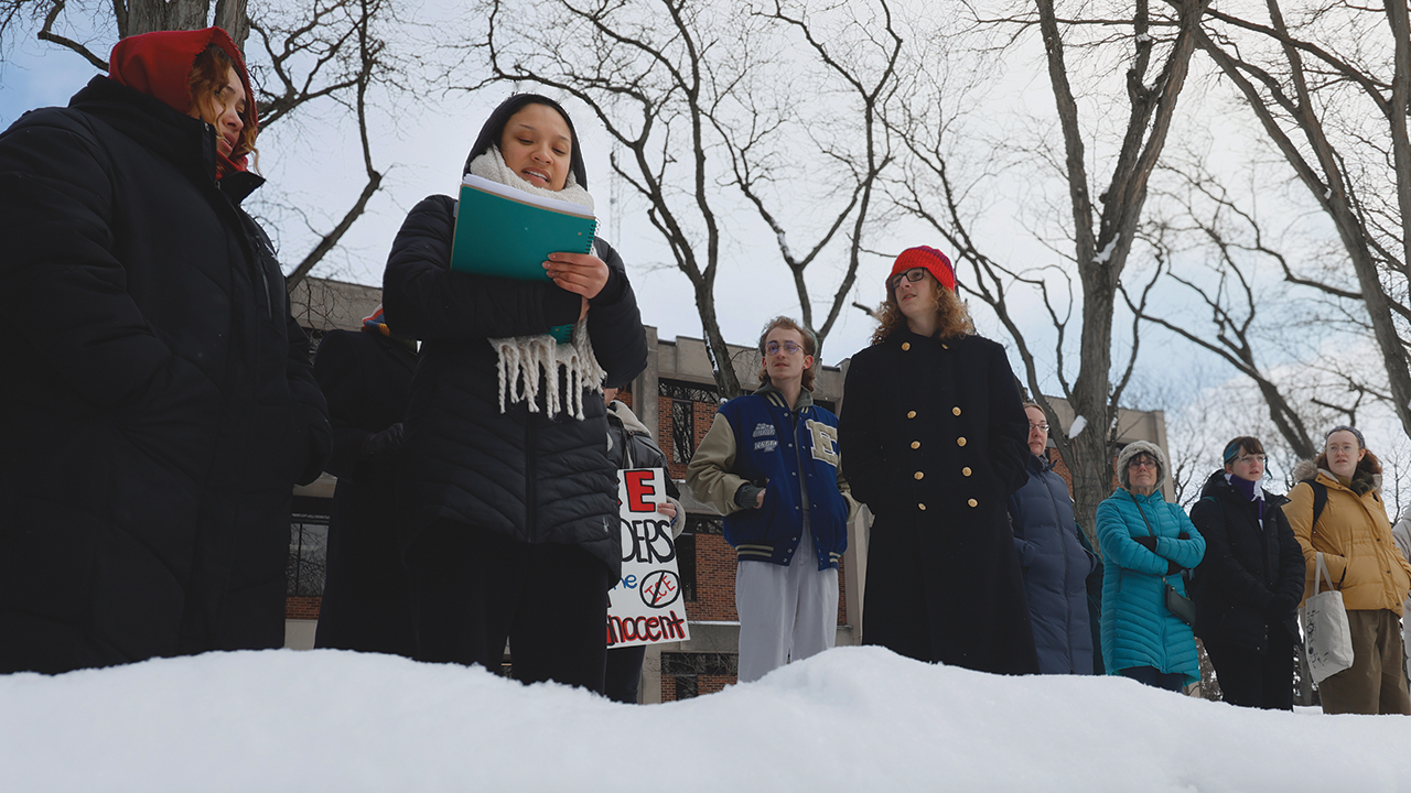 Goshen College student Eliza Alemán speaks Jan. 30 at a protest at Schrock Plaza. — The Record
