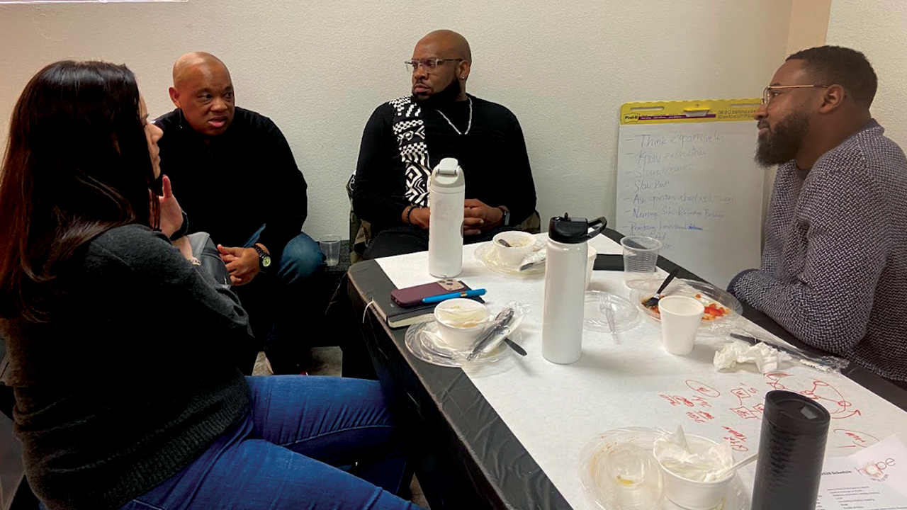 Madalyn Metzger, Glen Guyton, Trey Ferguson and Jerrell Williams converse during Hope for the Future at Cristiana Iglesia Roca de Refugio in San Antonio, Texas. — Sue Park-Hur/MC USA