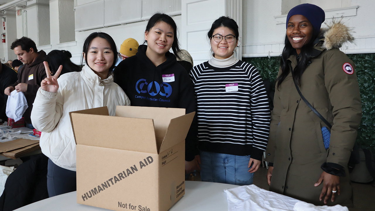 Claryn Cahyono, Marciella Shallomita, Graciella Odelia and Bilon Johnson prepare to assemble hygiene items into prison care kits for people incarcerated in Philadelphia. — MCC