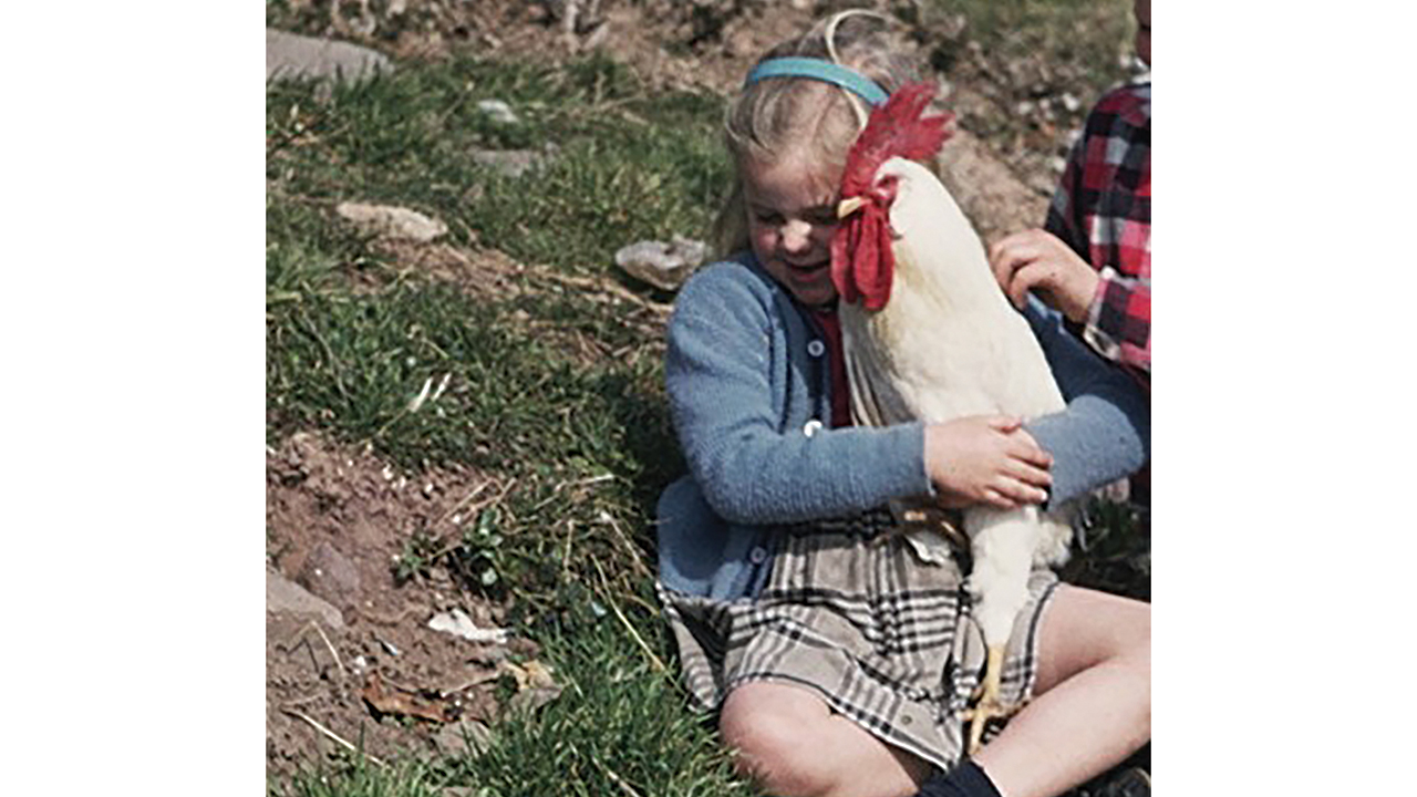 A young me with my pet rooster. — Courtesy of Carol Martin Johnson