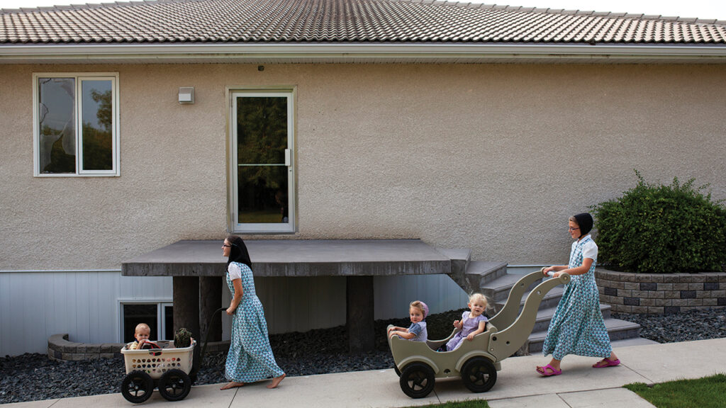 In 2015, Saphira Hofer and Nicole Wurtz look after some of the younger children at Deerboine Colony while their mothers work. — Tim Smith