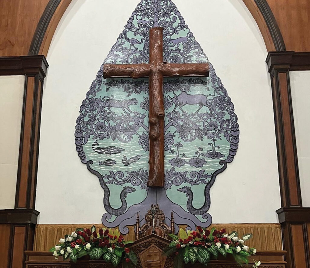 At the Jepara Mennonite congregation in Indonesia, a gunungan (traditional mountain-shaped symbol) depicts a variety of animals. — Courtesy of Douglas Day Kaufman