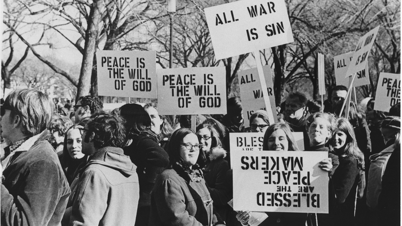 Mennonites display antiwar signs prior to the start of the March on Washington in November 1969. Between 200,00 to 500,000 demonstrators rallied in Washington in support of the end of the Vietnam War, beginning with a march along Pennsylvania Avenue to the Washington Monument, where a mass rally was held. — Burton Buller/MCC