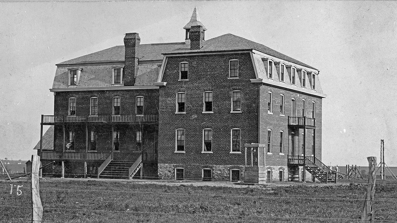 The Cantonment, Okla., school building, erected in 1890 and destroyed by fire in 1893. The school was established on a former U.S. military post given to Mennonites by the U.S. government. — Mennonite Library and Archives, Bethel College