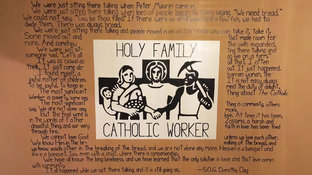 A painting on a living room wall of the now defunct Holy Family Catholic Worker House in Lancaster, Pa., where James Boll and his wife, Mary, lived featured a quote from Catholic Worker founder Dorothy Day and art from the masthead of The Catholic Worker newspaper, which Day founded in 1933. — Monica Domencic