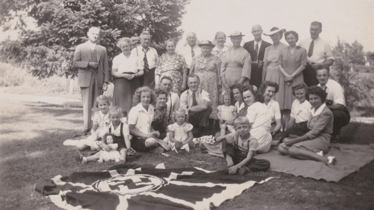A Mennonite family in Canada takes a photo with a Nazi flag in the late 1930s. Many Mennonite communities resonated with the new German ruling party’s anticommunist position as they remembered their experiences in the Soviet Union. “German Day” celebrations were common across Canada’s prairie provinces in the 1930s, ceasing with the beginning of the Second World War in 1939. — Jane Andres