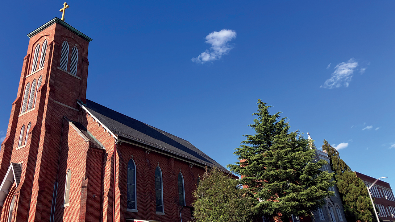 Hampden Mennonite Church and Hampden Christian School are taking ownership of the former St. Thomas Aquinas Church in Baltimore. To the right are the former Catholic church’s rectory and school. — Nathan Zook