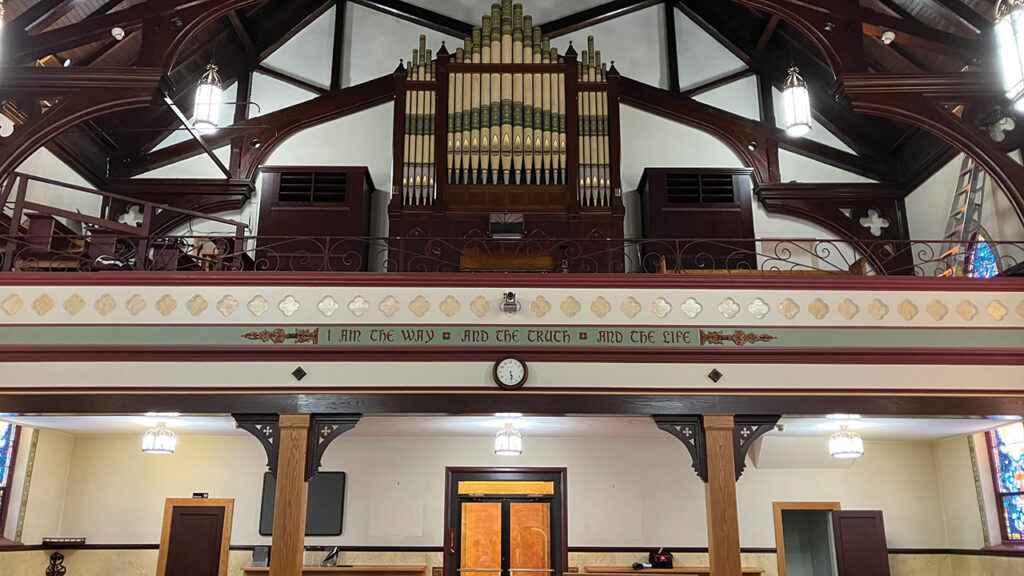A pipe organ resides among the ornate trusses above the balcony at the rear of the former St. Thomas Aquinas Church. — Nathan Zook