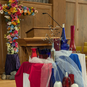 On the first Sunday of the “U.S.A. at 250” worship series, the chancel of First Mennonite Church of Bluffton, Ohio, was decorated in red, white and blue. — Courtesy of Phil Yoder