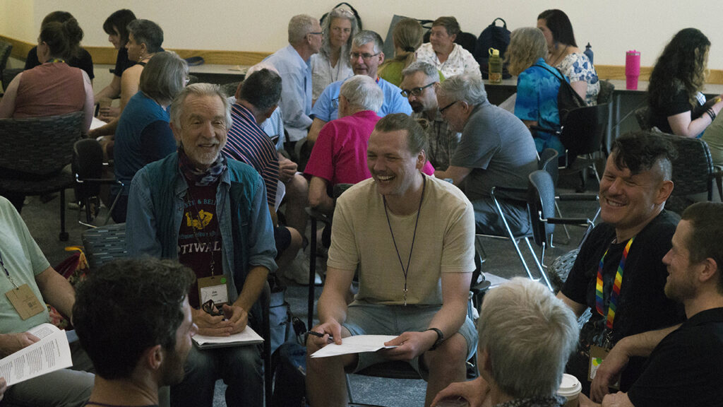 Jim Lichti of San Francisco, Blake Miller of Columbus, Ohio, and Joel Nofziger of Burien, Wash., converse during a workshop on queer theology. — Hannah Kraenbring/BMC