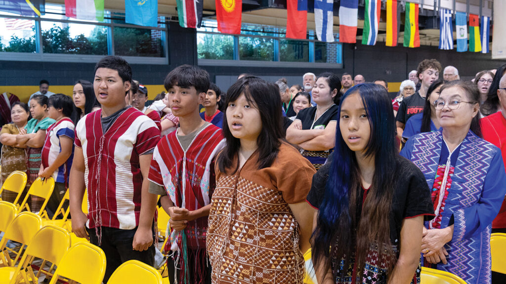Youth from Habecker Mennonite Church, an intercultural congregation in Lancaster, Pa., worship at the LMC assembly in June in Millersville, Pa. — Jonathan Charles for AW