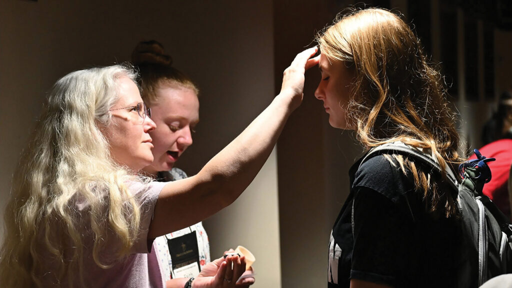 An anointing service at the Church of the Brethren National Youth Conference in Fort Wayne, Ind., in July. — Chris Brumbaugh-Cayford/Church of the Brethren