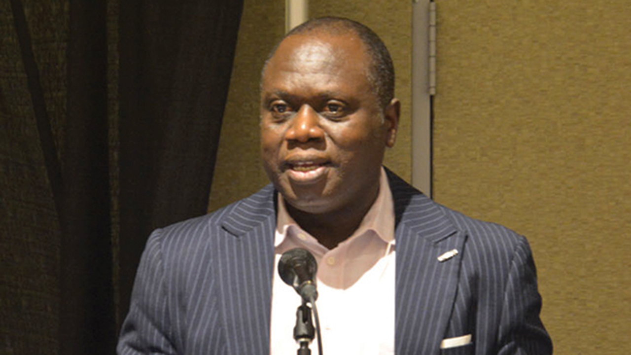Daniel Mbaya, president of the Church of the Brethren in Nigeria, addresses the Global Mission Dinner at the Church of the Brethren annual conference in Fort Wayne Ind. — Church of the Brethren Newsline