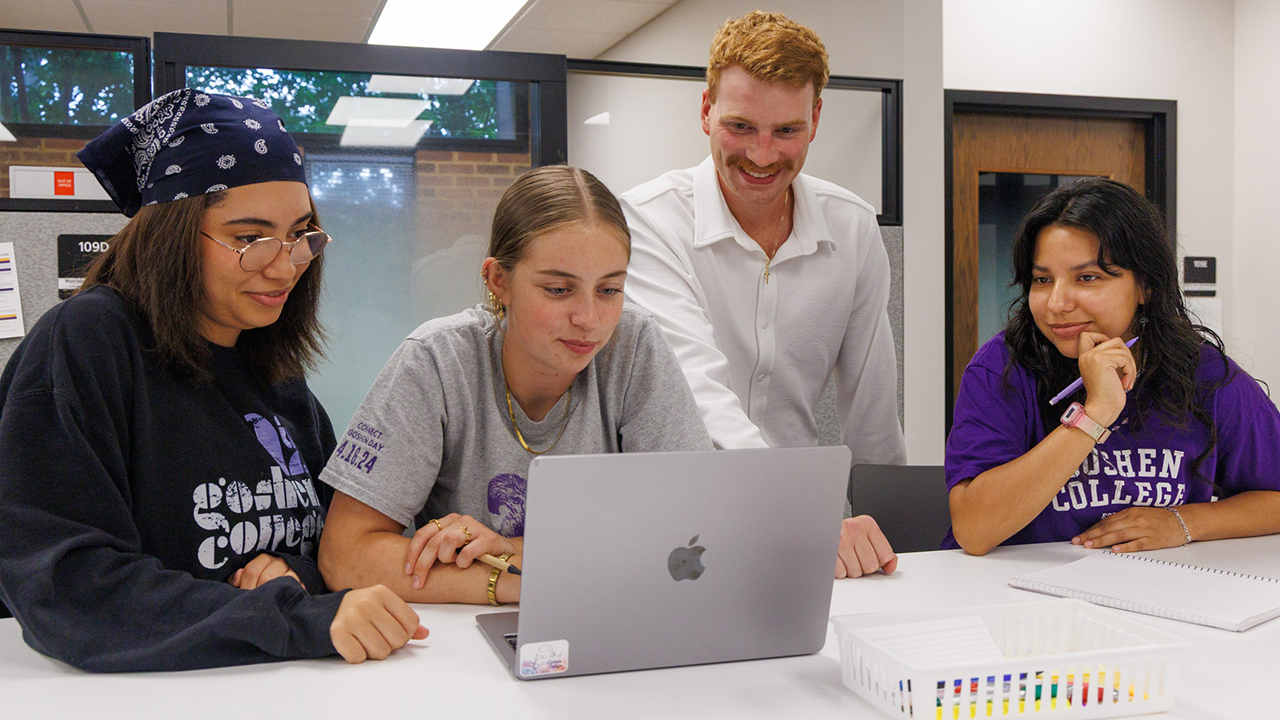 Goshen College students Ana Alves Machado, Caoimhe Farrell and Mafe Aguilar Vargas work with academic success coach Ian Fox, third from left, in the Academic Success Center in July. — Goshen College