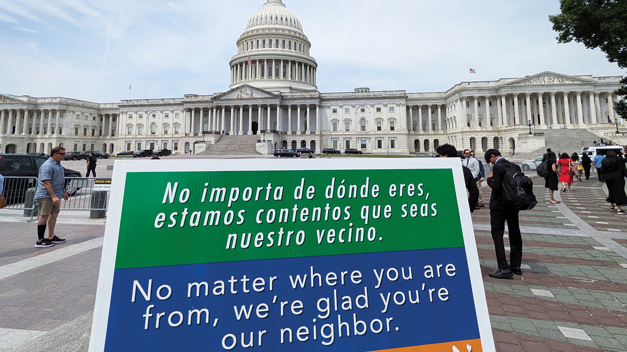 A “Welcome Your Neighbors” sign at the U.S. Capitol in Washington. The idea for the sign, which has become popular across the country, originated at Immanuel Mennonite Church in Harrisonburg, Va., in 2015. — Galen Fitzkee/MCC
