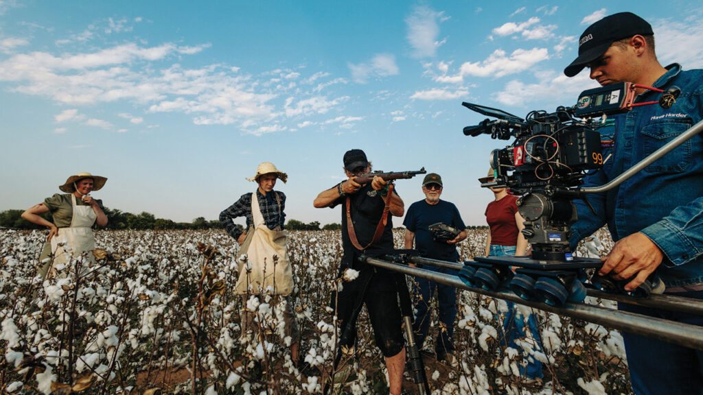 Dale Hildebrand demonstrates the pose young actor Jacob Dyck is to take, in a choice of mercy over vengeance. From left: Elisabeth Dueck (actor), Dyck, Hildebrand, Alan Goluboff (assistant director), Melanie Thiessen (translator), Marek Harder (camera assistant/operator). — Marcelo Kehler