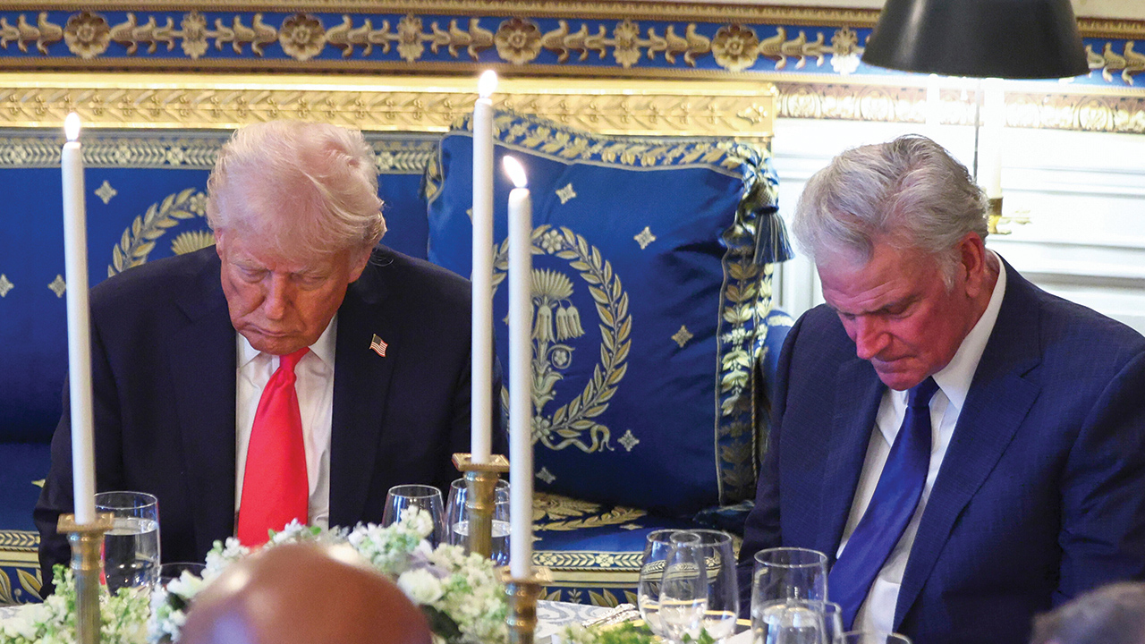 Donald Trump and Franklin Graham bow during a prayer at an Easter prayer service and dinner at the White House on April 16, 2025. — Pool via AP