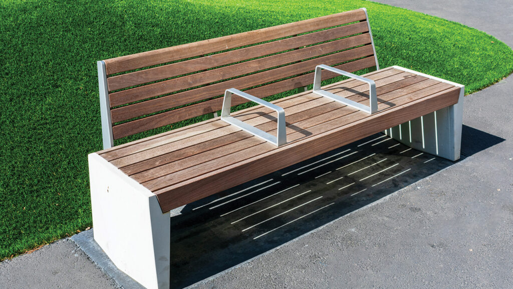 Hostile architecture, also known as exclusionary design, uses structural features to keep people from resting or loitering. Benches with armrests in the middle are a common example. — Michael Vi/Shutterstock