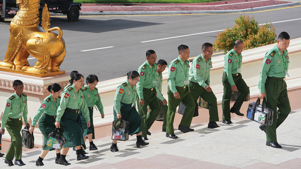 Myanmar’s military representatives arrive Oct. 12 to attend a session of the Union Parliament in Naypyitaw, Myanmar. — Aung Shine Oo/AP