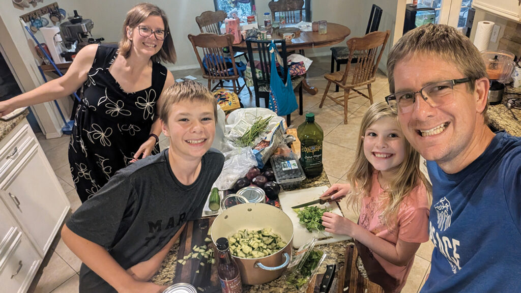 Rachel, Jonah, Hannah and Samuel Voth Schrag of Peace Mennonite Church in Dallas with the Gazpacho they made for MennoMedia’s “Cook Through More-with-Less with Us” challenge. The experience inspired a new family tradition of cooking one More-with-Less recipe together each week. — Courtesy of Samuel Voth Schrag